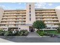 Exterior of a multi-story building with balconies and well-maintained landscaping at 4460 Fairways Blvd # 401, Bradenton, FL 34209