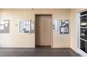 Interior view of an elevator with neutral walls and informational boards at 4460 Fairways Blvd # 401, Bradenton, FL 34209