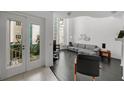 Bright living room featuring modern furnishings, hardwood floors, and a large window overlooking the courtyard at 4950 Bayshore Blvd # 14, Tampa, FL 33611