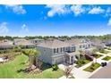 Suburban home in a quiet neighborhood, featuring manicured lawns and proximity to local amenities at 5407 Tagalong Pl, Apollo Beach, FL 33572