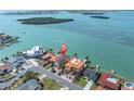 Aerial shot of waterfront homes, showing the property's prime location with easy access to the open bay at 700 126Th Ave, Treasure Island, FL 33706