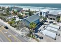 Picturesque oceanfront home with palm trees and nearby development, offering beachside living at 812 Gulf # 3, Indian Rocks Beach, FL 33785