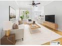 Staged living room with modern furniture, a large window, and stylish decor for a cozy atmosphere at 1810 E Palm Ave # 6104, Tampa, FL 33605