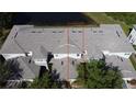 An aerial view shows the home's roof and landscaping at 19279 Stone Hedge Dr, Tampa, FL 33647