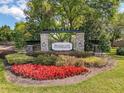 Stonegate entrance with landscaping and stone signage at 20352 Falling Rock Dr, Land O Lakes, FL 34638