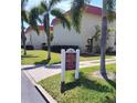Well-maintained townhomes with lush landscaping and mature palm trees at 2700 Bayshore Blvd #561, Dunedin, FL 34698