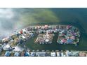 Overhead view of waterfront homes with boat docks and easy access to the open water and neighborhood streets at 3192 Gulf Winds Cir, Hernando Beach, FL 34607