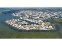 Wide shot of a coastal community offering waterfront homes, canals, and access to open waters at 3192 Gulf Winds Cir, Hernando Beach, FL 34607