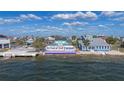 View of 65 feet of Gulf frontage, showcasing the home's waterfront location and outdoor space at 3192 Gulf Winds Cir, Hernando Beach, FL 34607