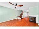 Well-lit living room with staircase, fireplace, and views into dining area at 5704 Bratton Dr # 2, Tampa, FL 33617