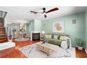 Inviting living room with fireplace, ceiling fan, and open concept to kitchen, perfect for entertaining at 5704 Bratton Dr # 2, Tampa, FL 33617