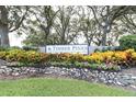 Timber Pines community sign, showing the well-maintained landscaping, promoting premier country club living at 7472 Clearmeadow Dr, Spring Hill, FL 34606