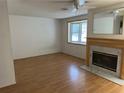 View of living room featuring hardwood floors and fireplace at 9741 Scenic Dr, Port Richey, FL 34668