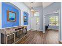 Bright foyer with high ceilings, art niches, and a view to the front door at 11009 Silver Dancer Dr, Riverview, FL 33579
