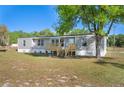 Beautiful single story home featuring a lovely wood deck and freshly mowed lawn at 2430 Keysville Dr, Lithia, FL 33547