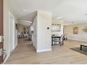Bright foyer with clean, modern flooring, flows into multiple living spaces at 3034 Gull Pl, Clearwater, FL 33762