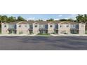 Inviting exterior showcases craftsman-style townhomes with lush landscaping, private garages, and neutral tones at 4425 Rachel Falls Dr, Tampa, FL 33610