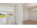 Open concept layout with tile floors, connecting the kitchen and dining area, bathed in natural light at 5335 Wolf Creek Dr, Apollo Beach, FL 33572