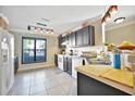Well-lit kitchen features stainless steel sink, white appliances, and dark cabinets at 6843 Se Dartmouth Hill St, Riverview, FL 33578