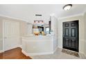 Bright, open kitchen with dark cabinets and stainless steel appliances at 6843 Se Dartmouth Hill St, Riverview, FL 33578