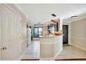 Bright, open kitchen with dark cabinets and stainless steel appliances at 6843 Se Dartmouth Hill St, Riverview, FL 33578