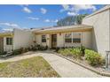 Charming single-story home featuring a well-maintained front lawn and inviting curb appeal at 8130 Braddock Cir # 3, Port Richey, FL 34668