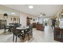 Spacious and open living area adjacent to the dining area for easy flow and socializing at 8130 Braddock Cir # 3, Port Richey, FL 34668