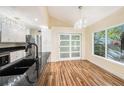 Bright kitchen featuring granite countertops, stainless steel appliances, and hardwood floors at 13518 Palmwood Ln # 13518, Tampa, FL 33618