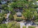 High-angle aerial shot of a house with mature trees in a tranquil, residential neighborhood at 203 S Coolidge Ave, Tampa, FL 33609