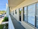 Balcony hallway with unit number and large windows bringing in plenty of natural light at 2331 Finlandia Ln # 43, Clearwater, FL 33763