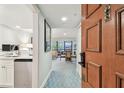 Inviting foyer with a dining area and a small kitchenette space, offering a modern living experience at 36750 Us 19 N # 19212, Palm Harbor, FL 34684