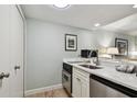 Contemporary kitchenette featuring stainless steel appliances, bright lighting, and ample counter space at 36750 Us 19 N # 19212, Palm Harbor, FL 34684