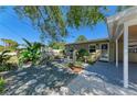 Cozy home exterior featuring a small patio and low-maintenance landscaping at 412 River S Blvd, Nokomis, FL 34275