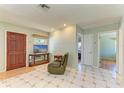 Open living area with tile flooring and neutral walls, ready for personalization at 412 River S Blvd, Nokomis, FL 34275