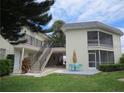 Charming condo with a screened lanai, outdoor seating, and well-manicured lawn and garden at 430 Larboard Way # 3, Clearwater Beach, FL 33767