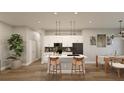 A bright kitchen with white cabinets, modern appliances, and a stylish island at 4503 Opel Ter, Port Charlotte, FL 33981