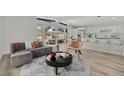 Bright, open living room featuring modern furnishings, eat-in kitchen, and plenty of natural light at 4720 50Th N Ave, St Petersburg, FL 33714