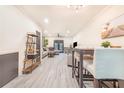Open-concept living and dining area with stylish furnishings, contemporary decor, and beautiful flooring at 506 S Willow Ave # 7, Tampa, FL 33606