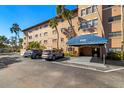 Beautiful condo building with covered entrance and parking spaces for residents and visitors at 6100 Gulfport S Blvd # 414, Gulfport, FL 33707