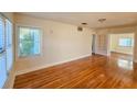 Bright living room featuring hardwood floors, large window with natural light, and an open floor plan at 860 16Th S Ave, St Petersburg, FL 33701