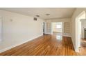 Spacious living room with hardwood floors and ample natural light, creating a warm atmosphere at 860 16Th S Ave, St Petersburg, FL 33701