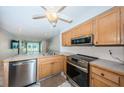 Well-equipped kitchen with stainless steel appliances and open layout at 9214 Mission Oaks Blvd, Seminole, FL 33776