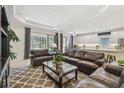Spacious living room featuring an open floor plan, comfortable seating, and natural light at 29488 Ginnetto Dr, Wesley Chapel, FL 33543