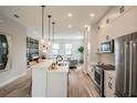 Modern kitchen featuring stainless steel appliances, white cabinets, and an open-concept design at 401 N Oregon Ave # 1, Tampa, FL 33606