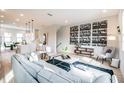 Stylish living room with modern decor, a large sofa, and an open layout flowing into the kitchen at 401 N Oregon Ave # 1, Tampa, FL 33606
