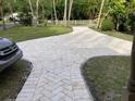 Long paved driveway leading to home and additional parking at 5706 River Terrace, Tampa, FL 33604