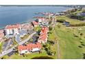 Beautiful waterfront community featuring golf course, lake, walking paths, and multiple carports at 6140 Sun Blvd # 5, St Petersburg, FL 33715