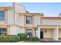 This townhome boasts a clean, two-story facade, private carport, and charming landscaping at 6140 Sun Blvd # 5, St Petersburg, FL 33715