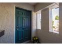 Stylish teal front door with decorative hardware and sidelight windows, creating a welcoming entrance at 720 Lyndhurst St # 1121, Dunedin, FL 34698