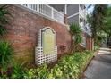Attractive Hyde Park Walk condominium signage amid lush greenery and brickwork at 800 S Dakota Ave # 221, Tampa, FL 33606